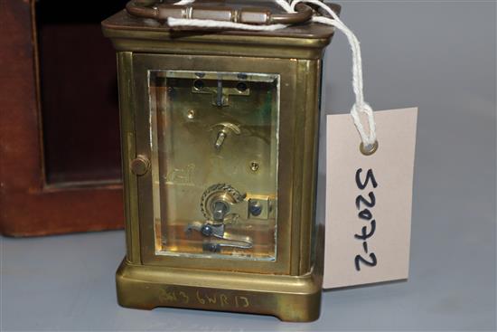 A brass mounted carriage timepiece and case